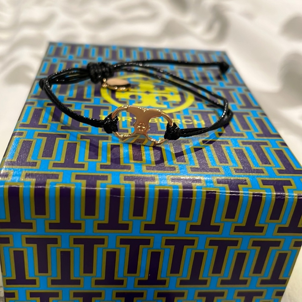 Beautiful brand new black Tory Burch bracelet with gold hardware.
